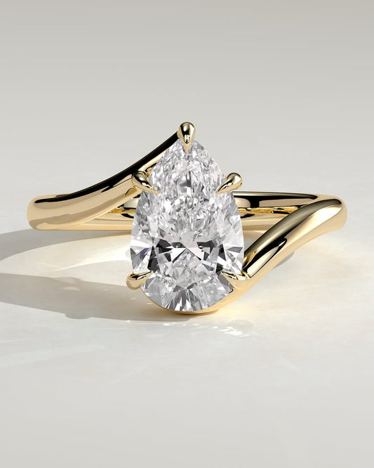 Pear Cut Crossover Sidestone Ring